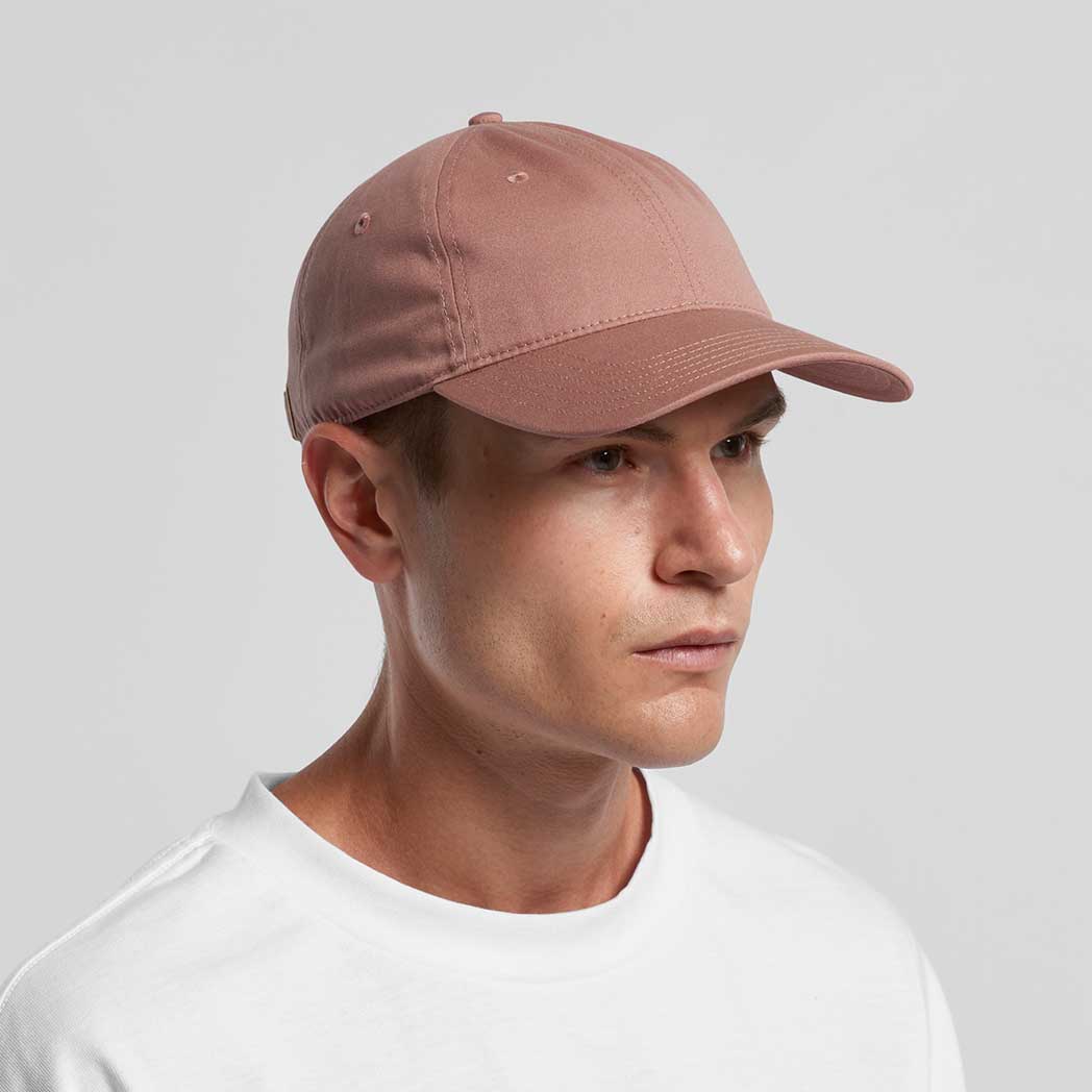 Man wearing a brown cap on a gray background