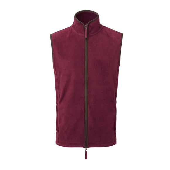 A sleeveless burgundy men's gilet with a high collar and a brown two-way zipper in the front. Premier Artisan Fleece Gilet - PR803