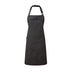 A black bib-apron with a leather-like adjustable strap at the neck and a pen pocket on the front. It is displayed against a white background. Premier Annex Oxford Bib Apron - PR144