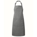 A grey denim bib apron with a center pocket, adjustable neck strap, displayed against a white background. Denim Bib Apron with Pocket - PR154