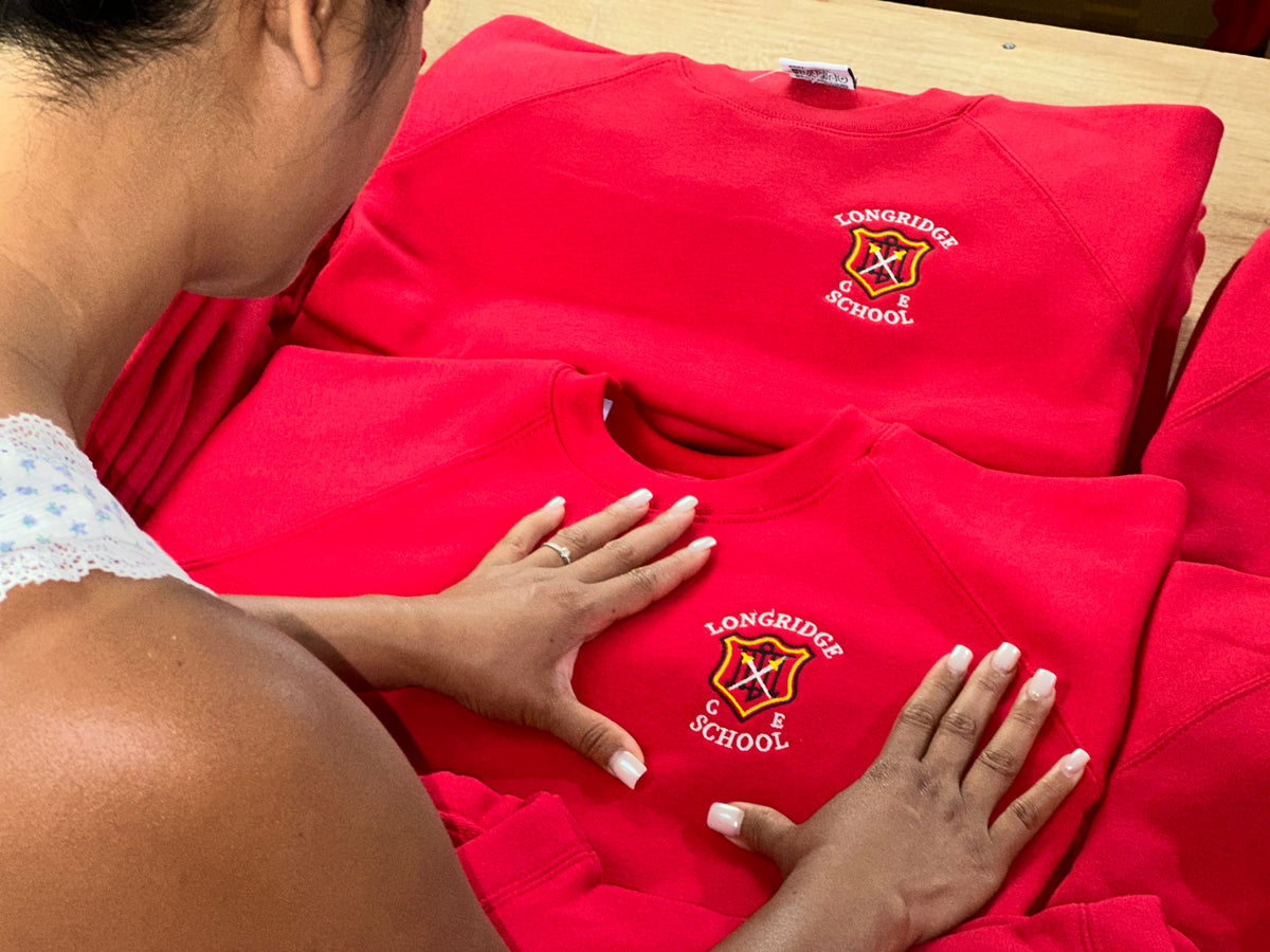 School crest embroidered on grey fleece