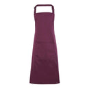 An aubergine purple bib apron with a neck strap and front pocket, displayed on a plain background. Colours Bib Apron with Pocket - PR154