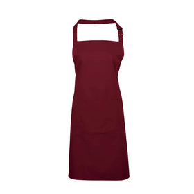 A burgundy brown bib apron with a neck strap and front pocket, displayed on a plain background. Colours Bib Apron with Pocket - PR154