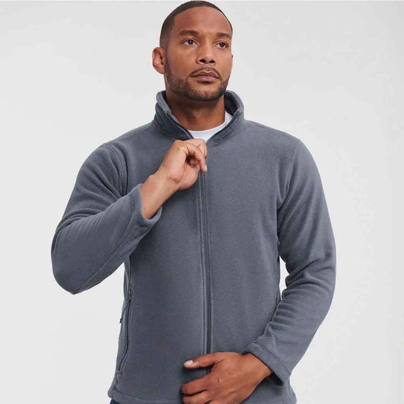 Man wearing Russell Full-Zip Outdoor Fleece - 870M in convoy grey on a light grey background.