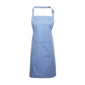 A mid blue bib apron with a neck strap and front pocket, displayed on a plain background. Colours Bib Apron with Pocket - PR154