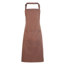 A mocha brown bib apron with a neck strap and front pocket, displayed on a plain background. Colours Bib Apron with Pocket - PR154