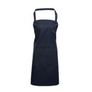A navy blue bib apron with a neck strap and front pocket, displayed on a plain background. Colours Bib Apron with Pocket - PR154