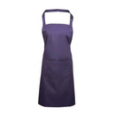 A purple bib apron with a neck strap and front pocket, displayed on a plain background. Colours Bib Apron with Pocket - PR154