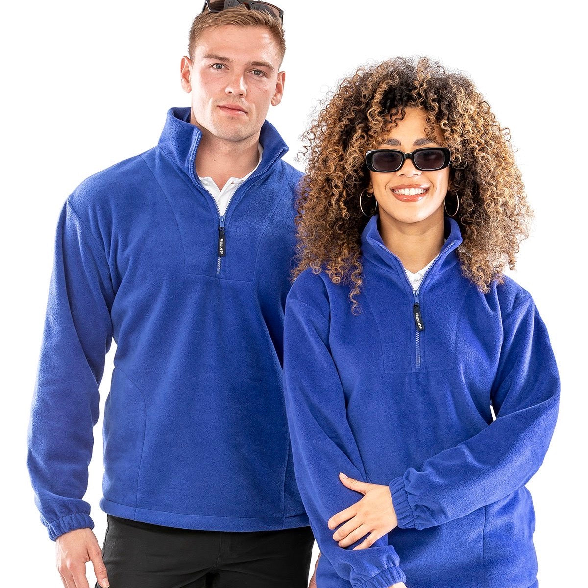 Two people wearing Result Polartherm 1/4-zip fleece - R33 in royal blue against a white background