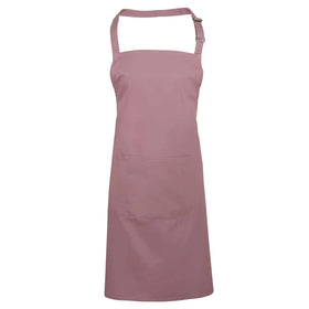 A rose pink bib apron with a neck strap and front pocket, displayed on a plain background. Colours Bib Apron with Pocket - PR154