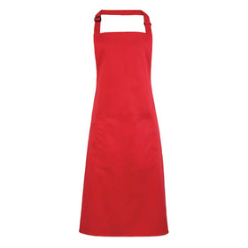 A strawberry red bib apron with a neck strap and front pocket, displayed on a plain background. Colours Bib Apron with Pocket - PR154