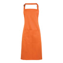 A terracotta bib apron with a neck strap and front pocket, displayed on a plain background. Colours Bib Apron with Pocket - PR154